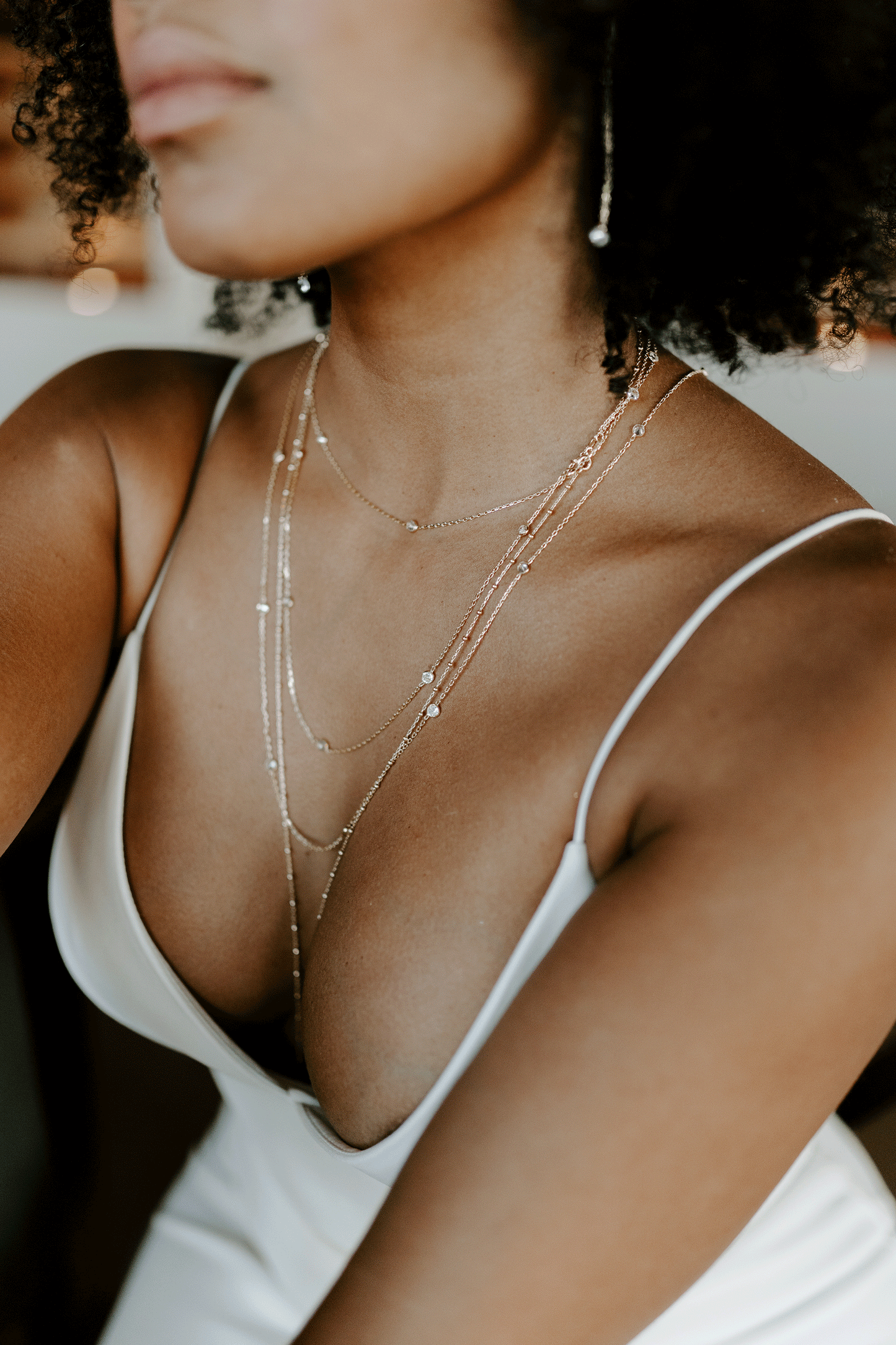 Beautiful woman wearing our constellation necklace. Sparkly, gold and stunning