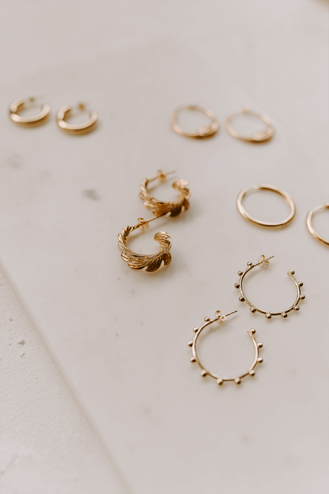 gold hoops on a display